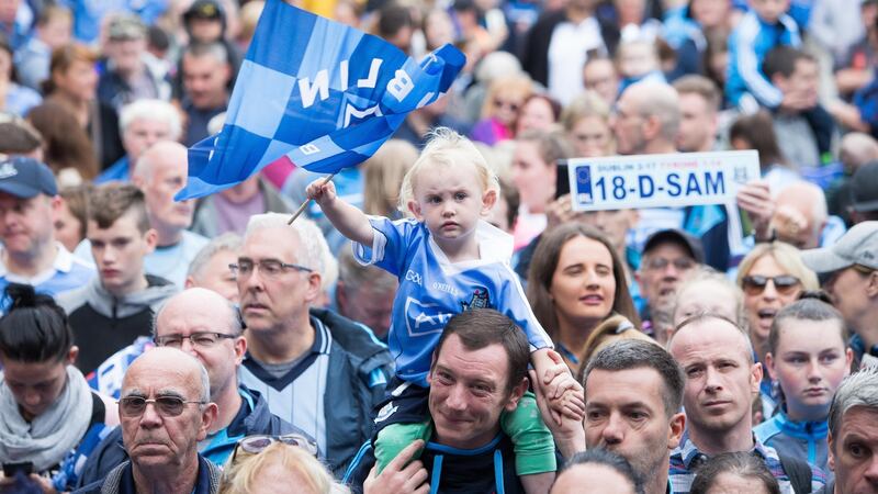 Charlie Brady (aged two) and her dad Patrick from Tallaght at the celebration for the Dublin team at  Smithfield Square, Dublin. Photo: Tom Honan