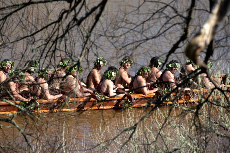 A waka, a traditional canoe, is paddled by warriors on the Waikato River as part of the funeral of New Zealand’s Maori king. Photograph: Alan Gibson/AP