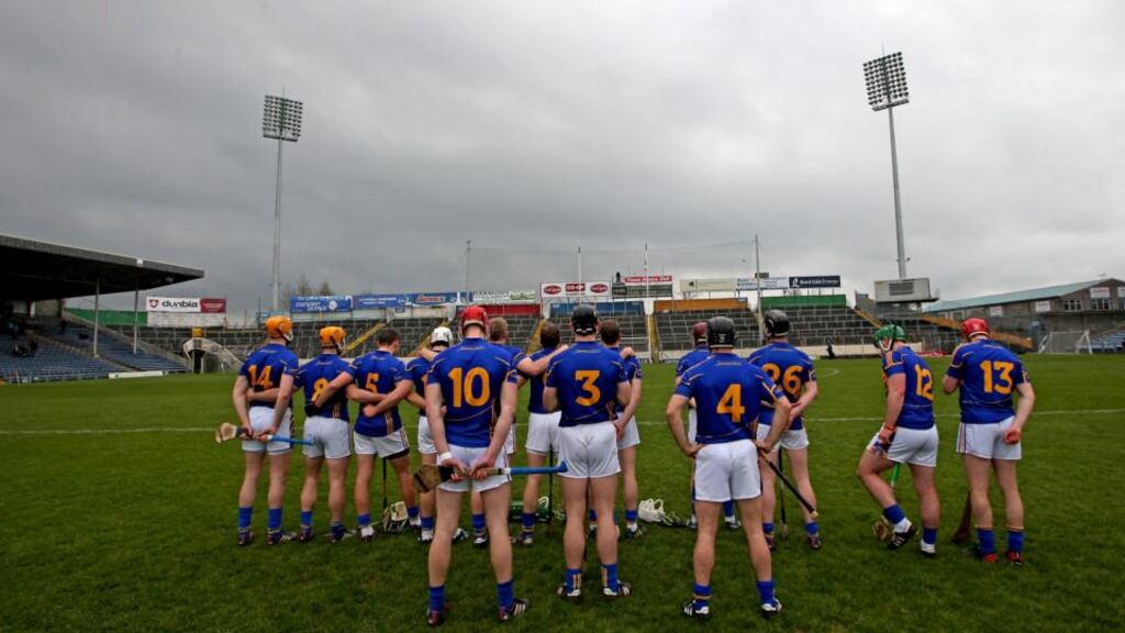 The Tipperary team stand for the national anthem before the start of the game against Cork. Photograph: James Crombie/Inpho