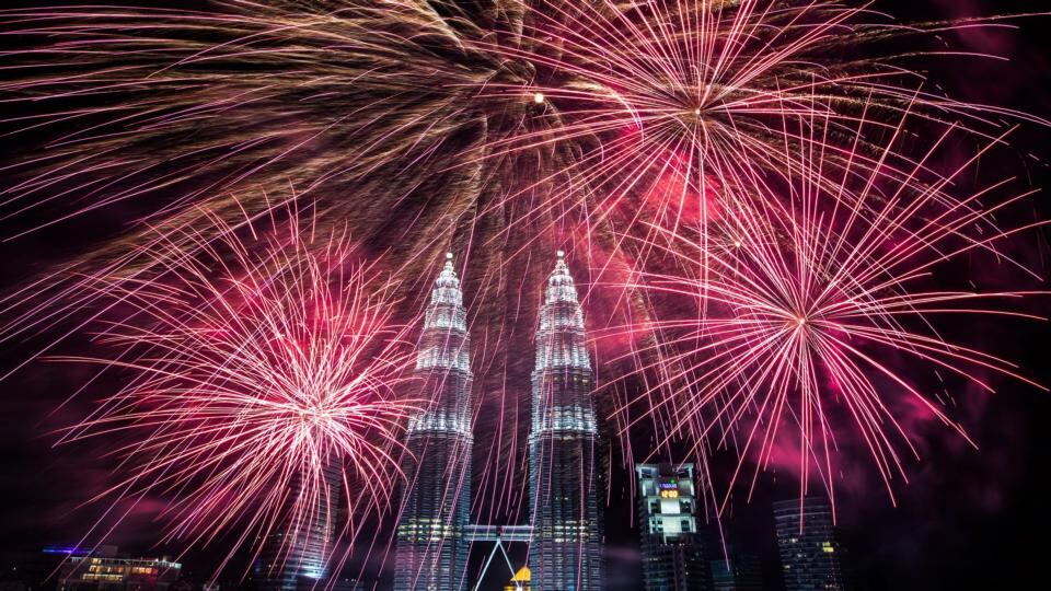 Fireworks explode near Malaysia’s landmark, Petronas Towers in Kuala Lumpur. Photograph: Ahmad Yusni/EPA