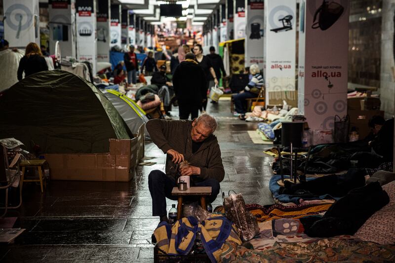 A man prepares a cup of tea in a metro station in Kharkiv last April: Hundreds of thousands fled the city and its surrounding region in the first months of the war. Photograph: Dimitar Dilkoff/Getty