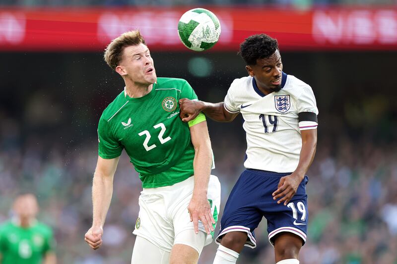 Ireland’s Nathan Collins and Angel Gomes of England. Photograph: Laszlo Geczo/Inpho
