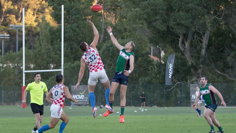 Gavin Murray of South Dublin Swans and Ireland, battles in the ruck against Josip Habljak of Croatia, in the final of the Euro 2016 AFL Championship in Lisbon