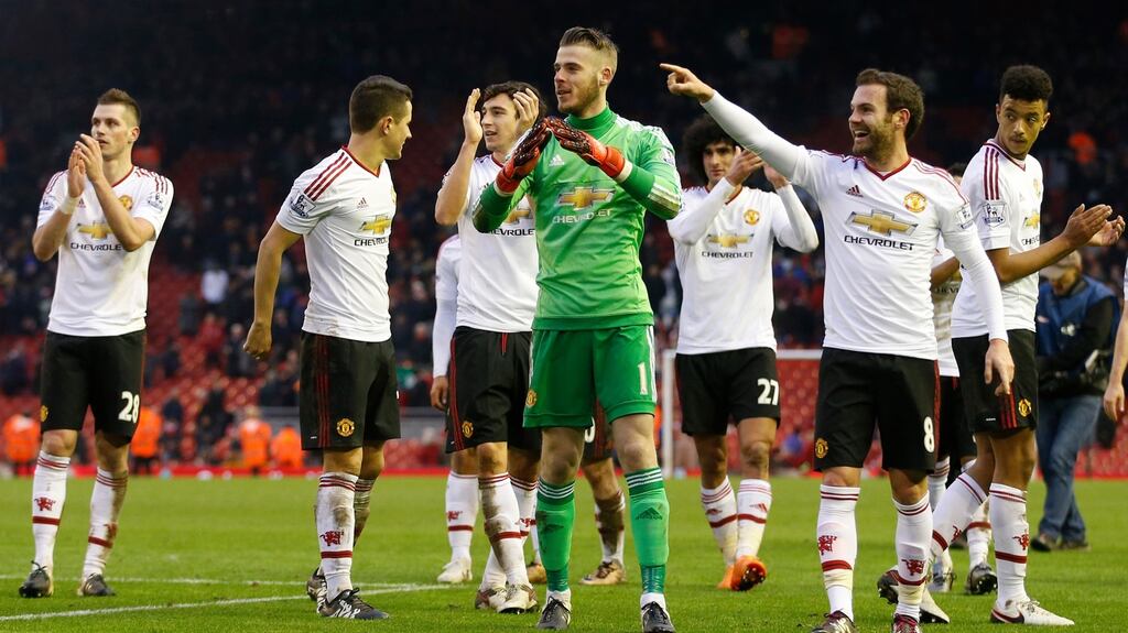 Manchester United’s David De Gea celebrates at full time with Juan Mata, Matteo Darmian, Wayne Rooney and teammates. Photograph: Carl Recine/Reuters