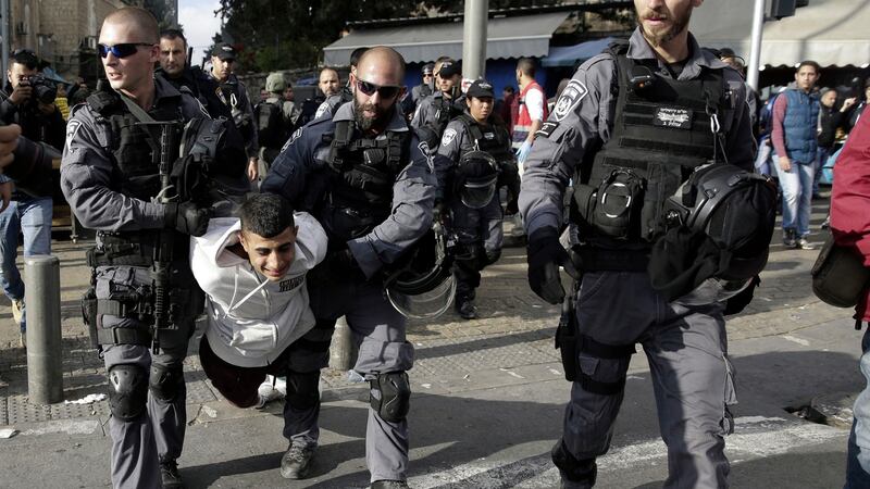 Israel police arrest a Palestinian following a protest in Jerusalem. Photograph: AP Photo/Mahmoud Illean