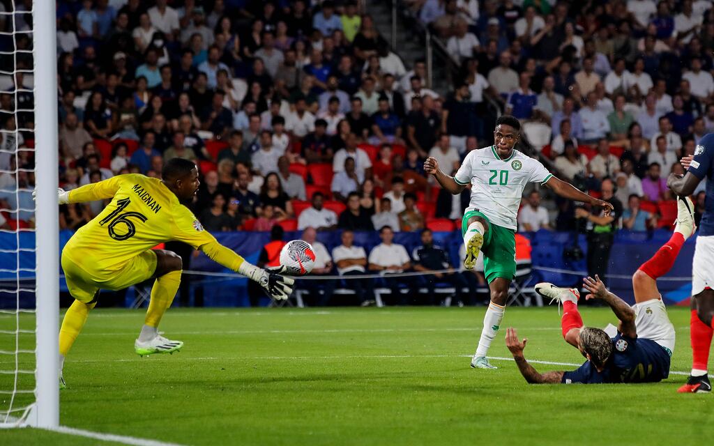 Chiedozie Ogbene watches as hit header is saved in the second half of Ireland's defeat. Photograph: Ryan Byrne/Inpho