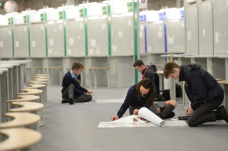 Students setting up at their displays in the RDS Dublin before the exhibition’s opening Photograph: Dara Mac Dónaill/The Irish Times