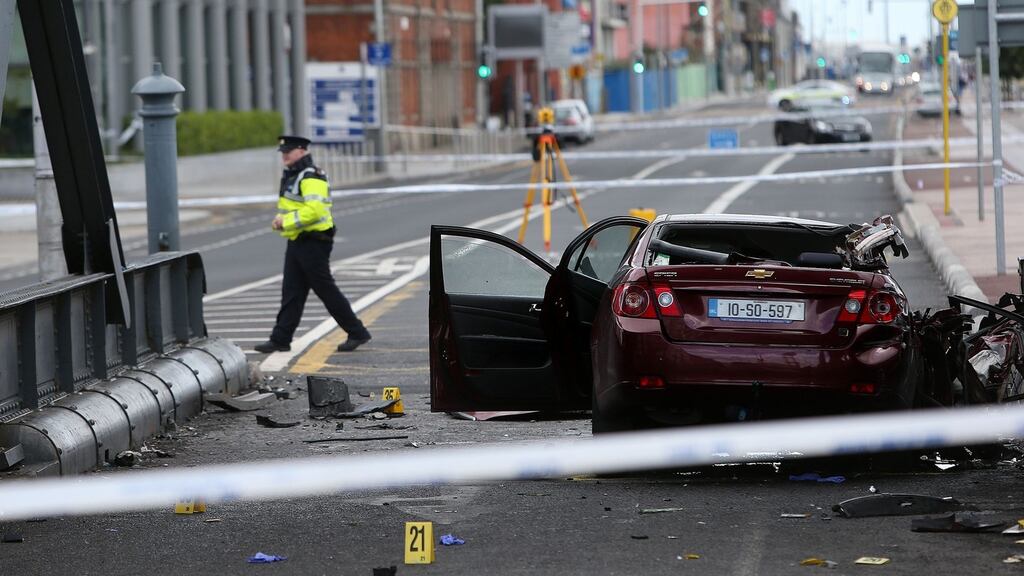 The hijacked taxi which crashed into a lock bridge on North Wall quay in Dublin city centre early on Monday. Photograph: Julien Behal/PA Wire