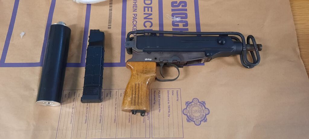 Gardaí seized a suspected firearm along with a silencer, loaded magazine and ammunition during the course of a search at an apartment complex in Finglas. Photograph: Garda Press Office