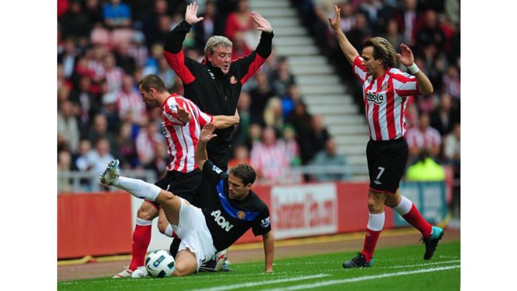 Michael Owen and Phillip Bardsley get in a tangle with Sunderland manager Steve Bruce during today’s 0-0 draw. Photograph: Owen Humphreys/PA Wire