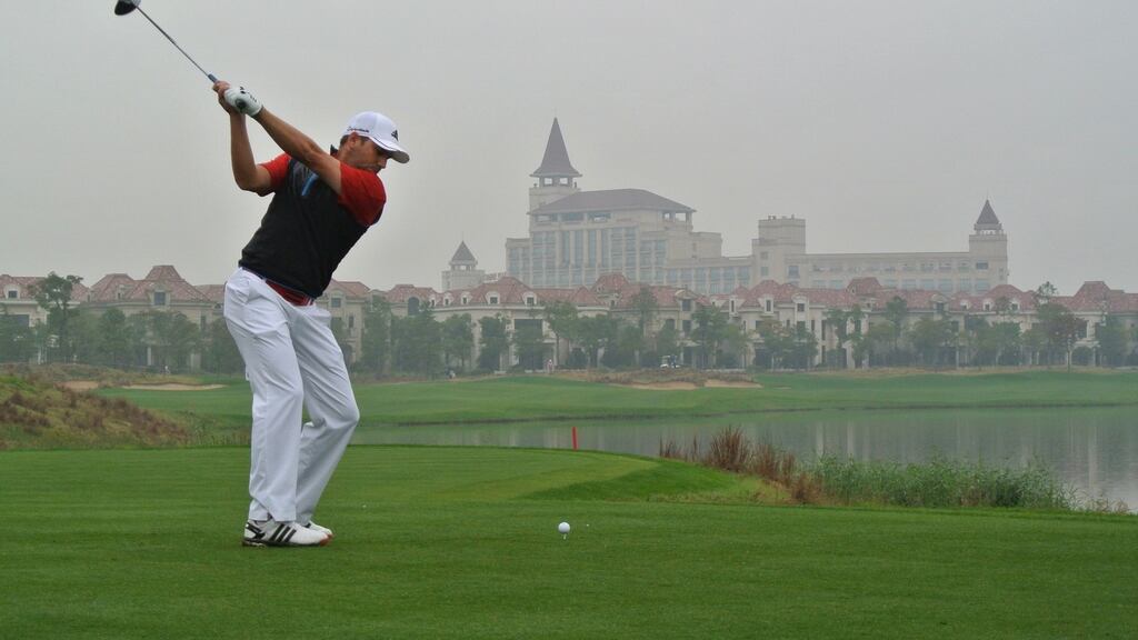 Sergio Garcia tees off at ninth on his way to an opening round of 64 to lead the BMW Masters. Photo: Andrew Redington/Getty Images