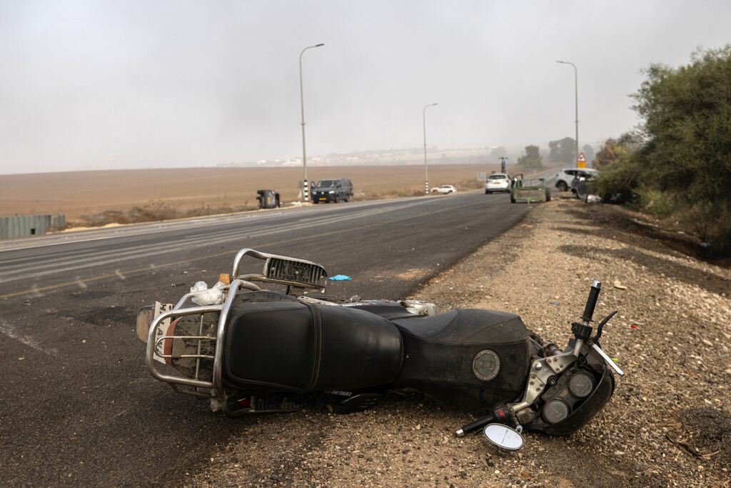 A motorcycle used by a Hamas gunman lays on a road near Sderot, Israel on October 8th, 2023. Photograph: Tamir Kalifa/The New York Times