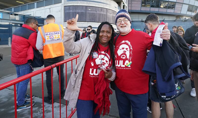 Lula da Silva supporters Geneci da Cruz iu Fhatharta and her husband Gearóid Ó Fátharta at Croke Park in Dublin, as thousands of Brazilian citizens from all over Ireland gather to vote in their country's presidential election. Photograph: Niall Carson/PA