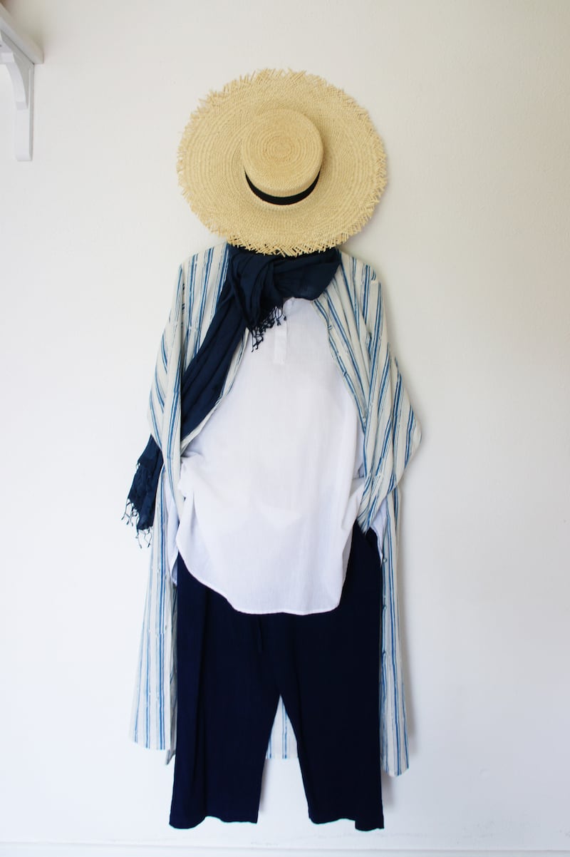 Long block printed shirt Û380, white pull over shirt Û310, indigo trousers Û260, Clementine natural straw boater with extra wide brim Û189.