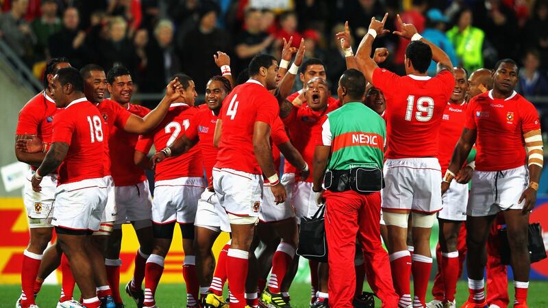 Tonga celebrate their famous win over France at the 2011 Rugby World Cup. Photograph: Phil Walter/Getty