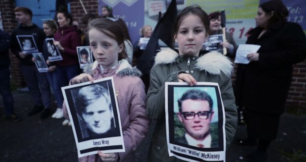 Children hold pictures of Bloody Sunday victims during a vigil in Belfast last month. Photograph: Niall Carson/PA Wire