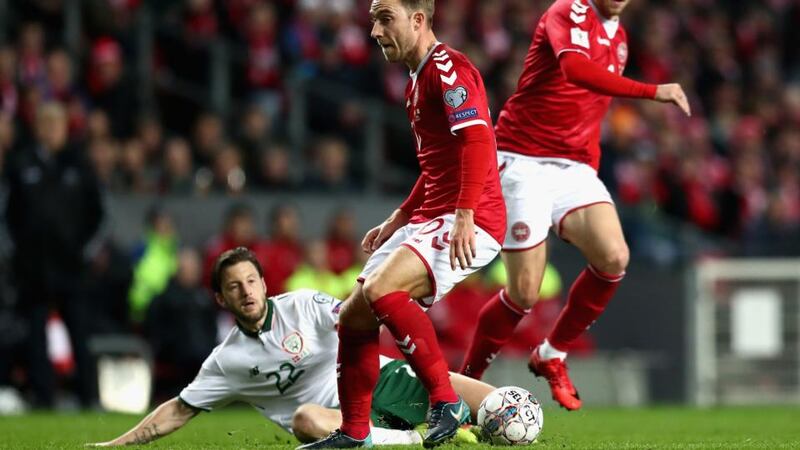 Harry Arter is tackled by Christian Eriksen during Ireland’s draw with denmark. Photograph: Catherine Ivill/Getty