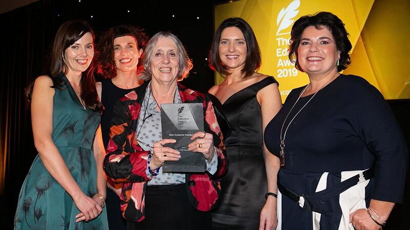 Dr Shelagh Waddington, Emeritus Lecturer, Geography Department, Maynooth University presents the Best Academic Partnership award to The SURE Network Team.