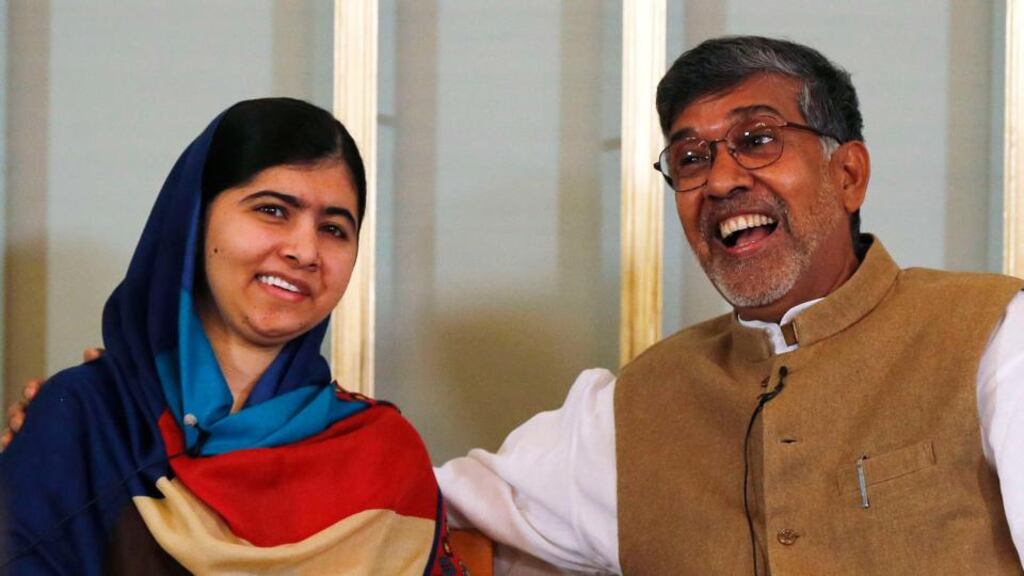 Nobel Peace Prize laureates Kailash Satyarthi (R) and Malala Yousafzai during a news conference in Oslo on Tuesday.  Photograph: Suzanne Plunkett/Reuters