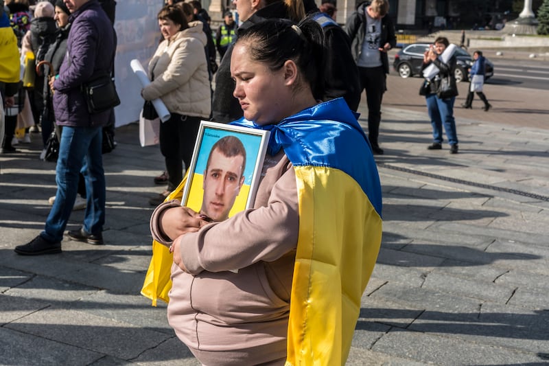 Svitlana Makovoz holds a photo of her husband, Andriy, at a protest to bring attention to soldiers who are missing in action, at Independence Square in Ukraine’s capital of Kyiv, on October 16th. Photograph: Brendan Hoffman/New York Times
