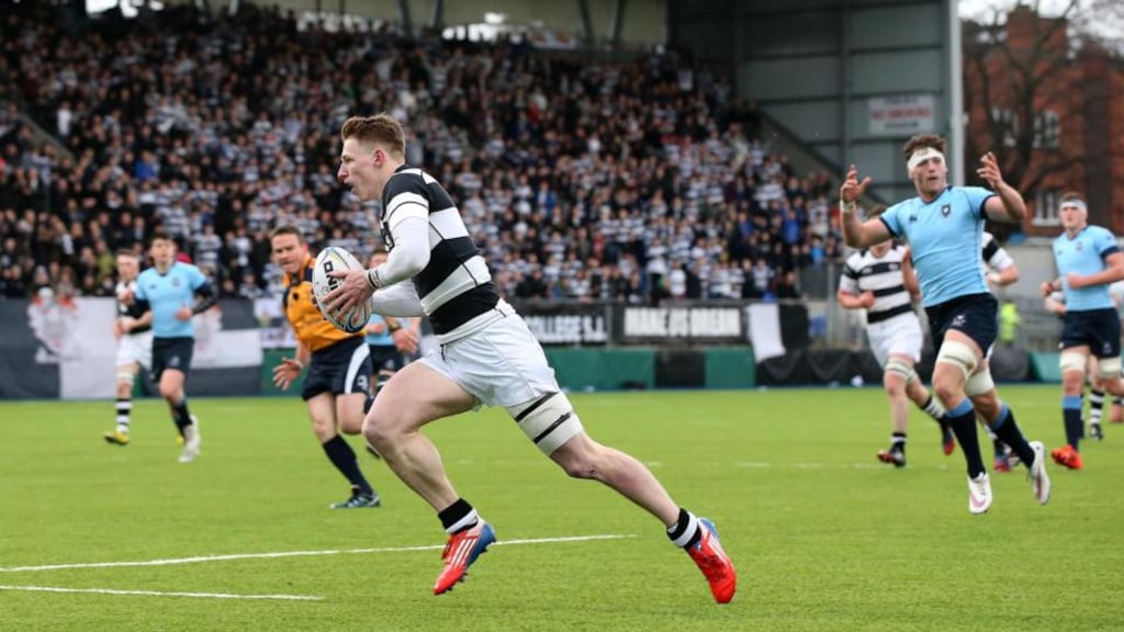 Belvedere’s James McKeown on his way to scoring the first try against St Michael’s College in the semi-final. Photograph: Ryan Byrne/Inpho