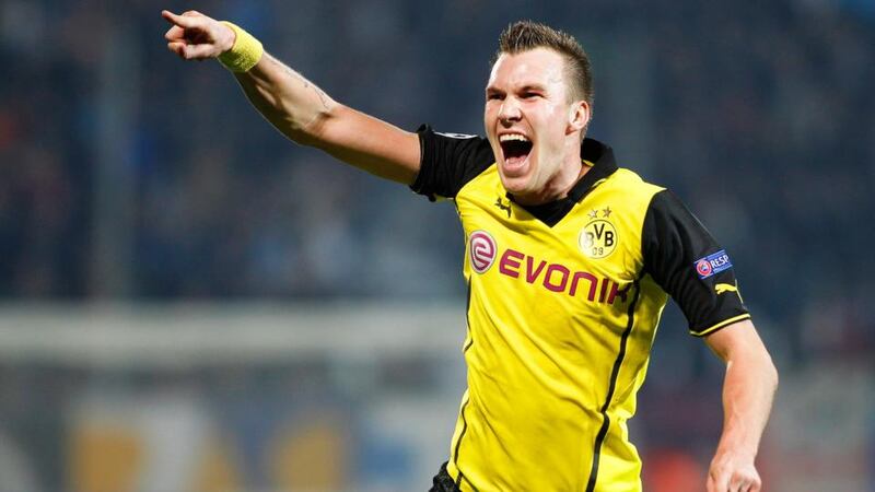 Kevin Grosskreutz of Borussia Dortmund celebrates after scoring the winner against Olympique Marseille at Stade Velodrome. Photograph: Sebastian Nobogier/EPA