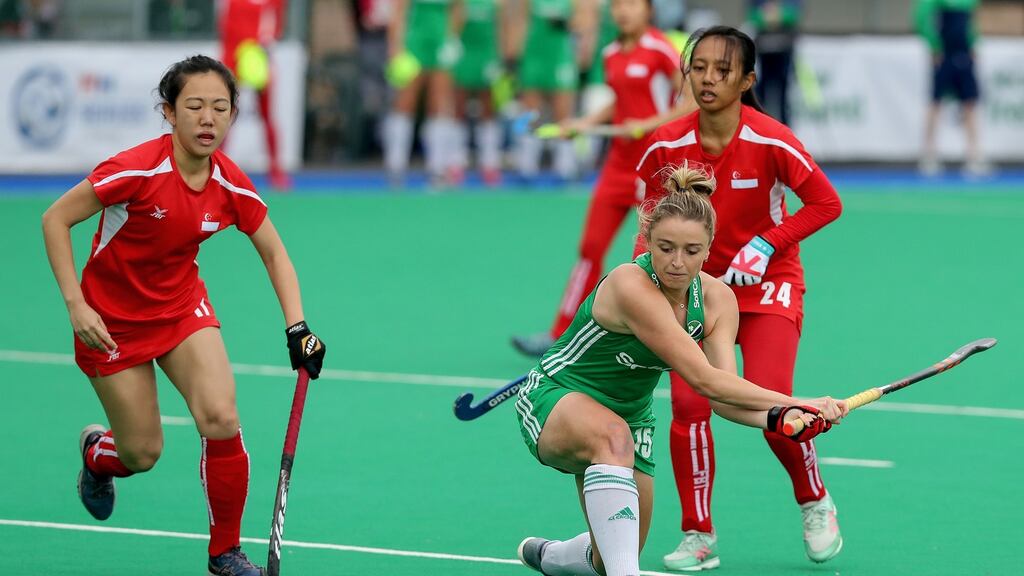 Ireland’s Gillian Pender scores against Singapore during the FIH Women’s Series Pool A clash at Banbridge Hockey Club, Belfast. Photograph: Bryan Keane/Inpho
