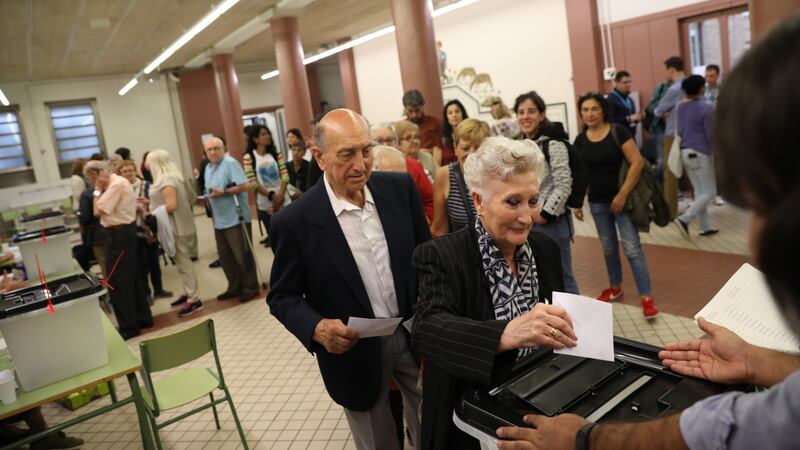 A woman casts her ballot as she votes in the referendum at Escola Collaso I Gil public school polling station. Photograph: Dan Kitwood/Getty Images