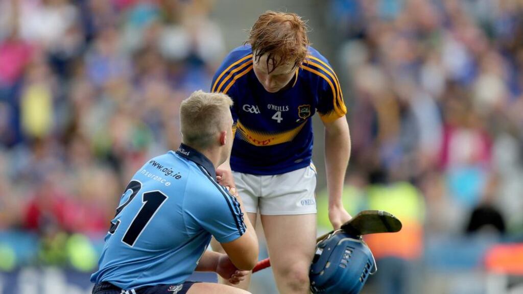 Tipperary’s James Quigley consoles Dublin’s Gavin King after his side’s All-Ireland minor hurling semi-final win. Photograph: Inpho
