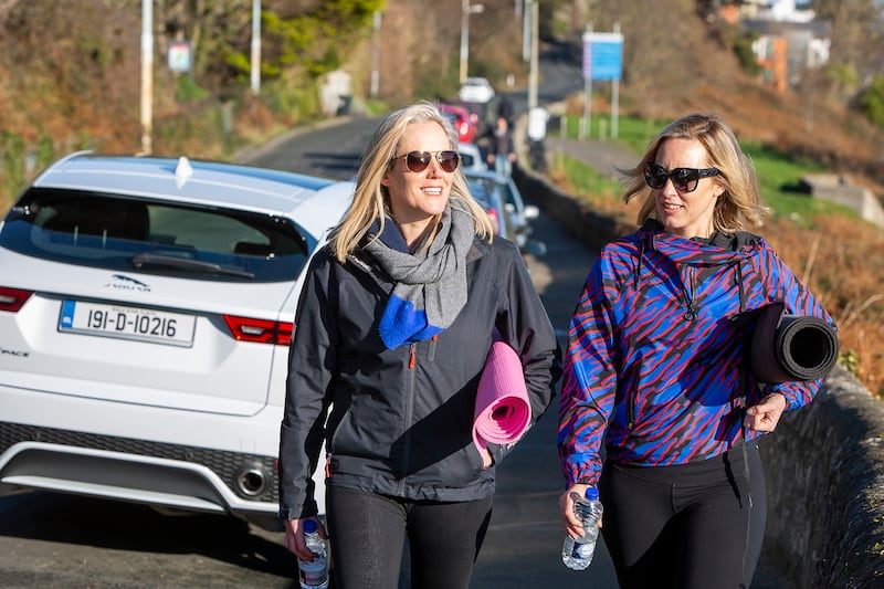 Liz Dwyer and Kathryn Thomas: the sun suddenly comes just in time for us to march down the hundred plus steps to White Rock beach for a few downward dogs and a long walk. Photograph: Rob O’ Connor