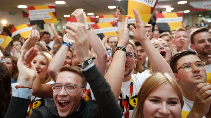 Supporters of the Christian Democratic Union (CDU) react as exit poll results were broadcasted on television in Berlin. Photograph: AFP/Getty Images