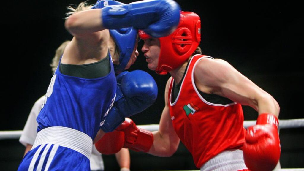 Ireland’s Katie Taylor (red) in action against Romania’s Lavinia Mera in Bucharest. Photograph: Octavian Cocolos / Inpho