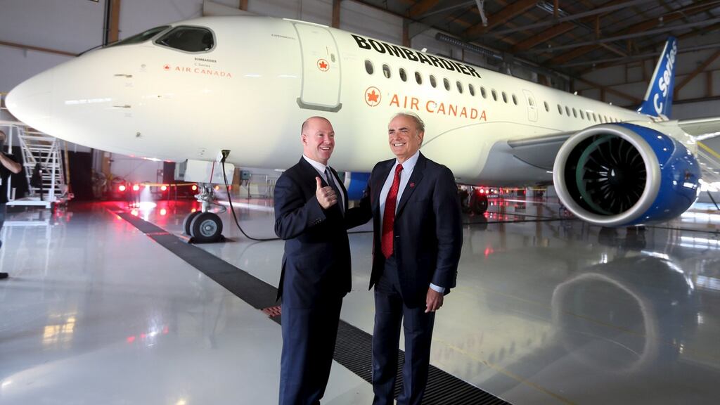 Alain Bellemare, president and chief executive officer of Bombardier, with Air Canada’s president Calin Rovinescu. Photograph: Christinne Muschi/Reuters