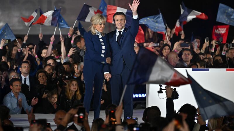 Emmanuel Macron stands with his wife Brigitte Macron after he beats his far-right rival Marine Le Pen for a second five-year term as president. Photograph: Jeff J Mitchell/Getty
