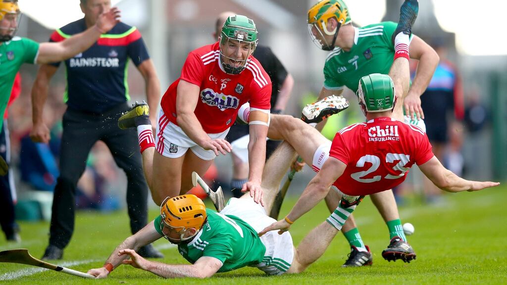 Cork’s Aidan Walsh and Shane Kingston contest for the ball with Richie English and Dan Morrissey of Limerick. Photograph: James Crombie/Inpho