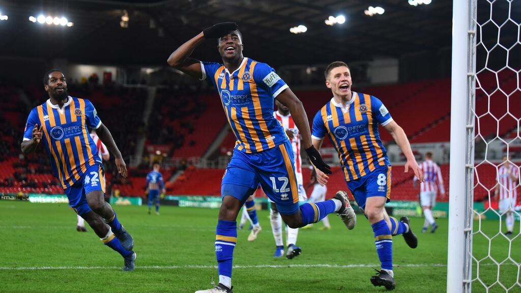 Fejiri Okenabirhie of Shrewsbury Town celebrates after scoring his side’s second goal during the FA Cup third round replay against Stoke City. Photo: Nathan Stirk/Getty Images