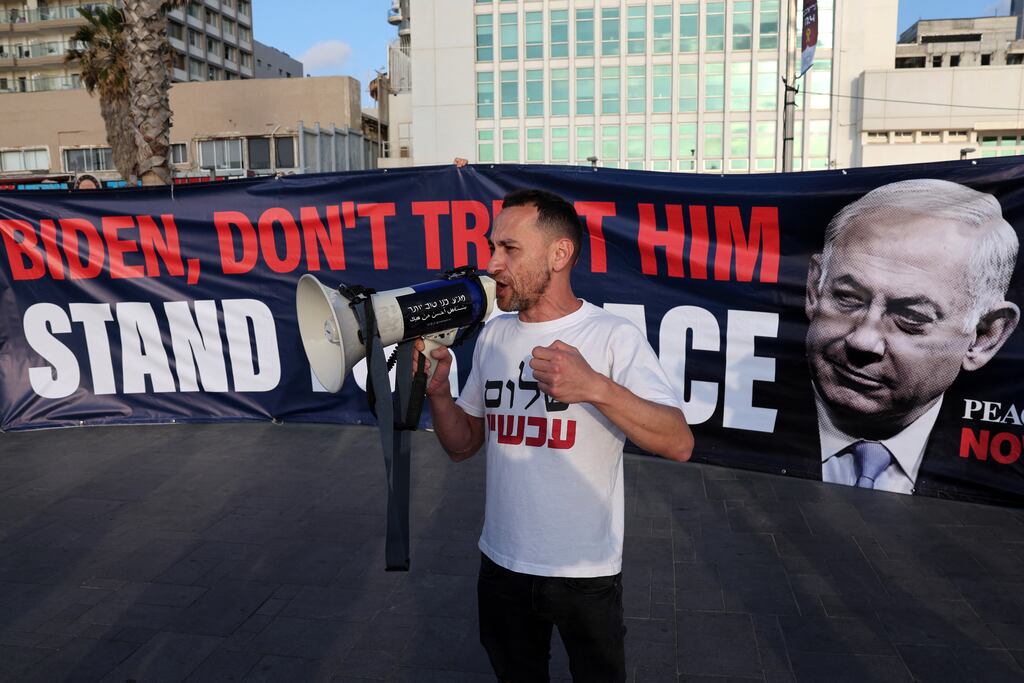 A protester outside the US embassy in Tel Aviv: It appears Israel aims to inflict significant damage on Iran but without large-scale casualties or prompting a military response that will plunge the entire region into chaos. Photograph: Jack Guez/AFP
