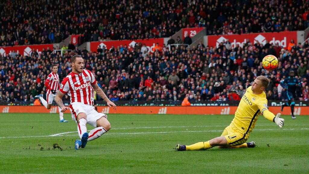 Stoke’s Marko Arnautovic missed out on a hat-trick as this shot beat Manchester City’s Joe Hart but came back off the post.  Photo: Phil Noble/Reuters