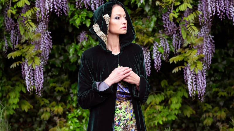 Gold braided emerald green velvet cape €1,295, St Brigid printed silk dress €795. Photograph: Una Williams