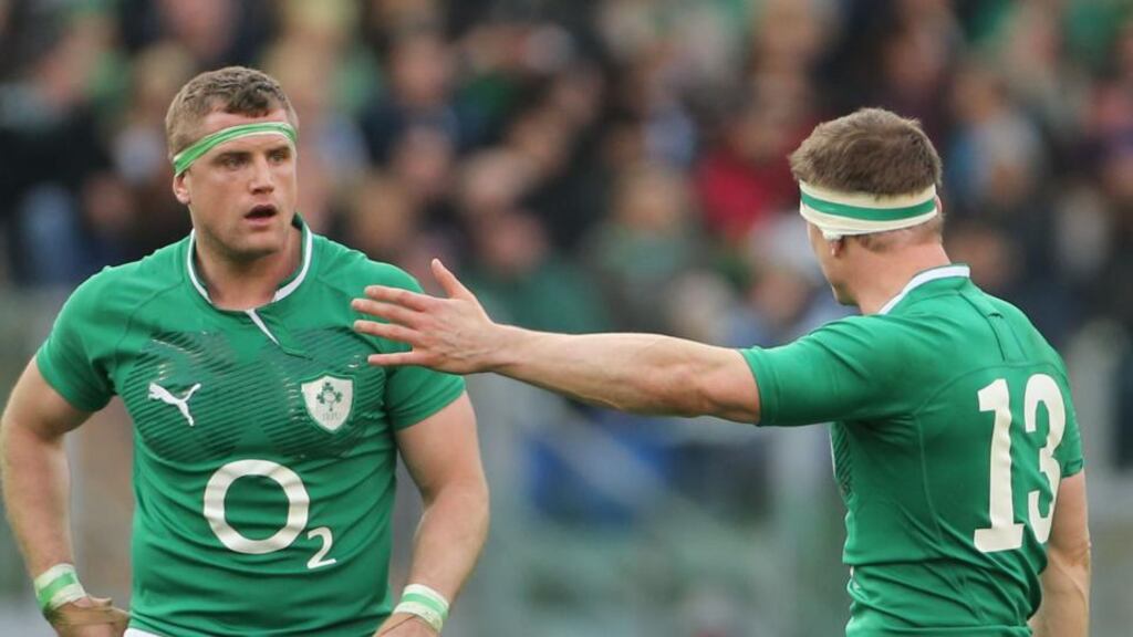 Jamie Heaslip and Brian O'Driscoll have words during the defeat to Italy at the Stadio Olimpico. Photograph: Niall Carson/PA Wire.