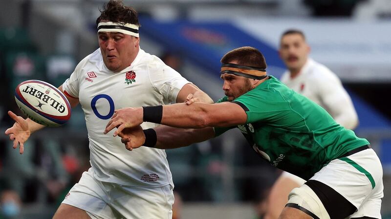 CJ Stander passes the ball under pressure from Jamie George. Photograph: Adrian Dennis/Getty/AFP