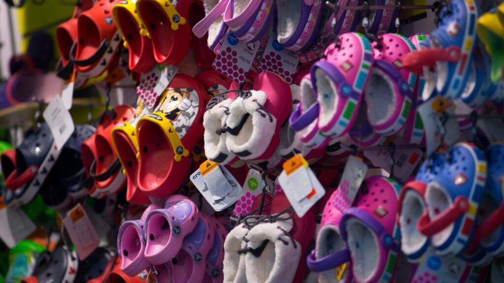 Crocs  shoes are displayed for sale at a store in New York yesterday.  Photograph: Jin Lee/Bloomberg