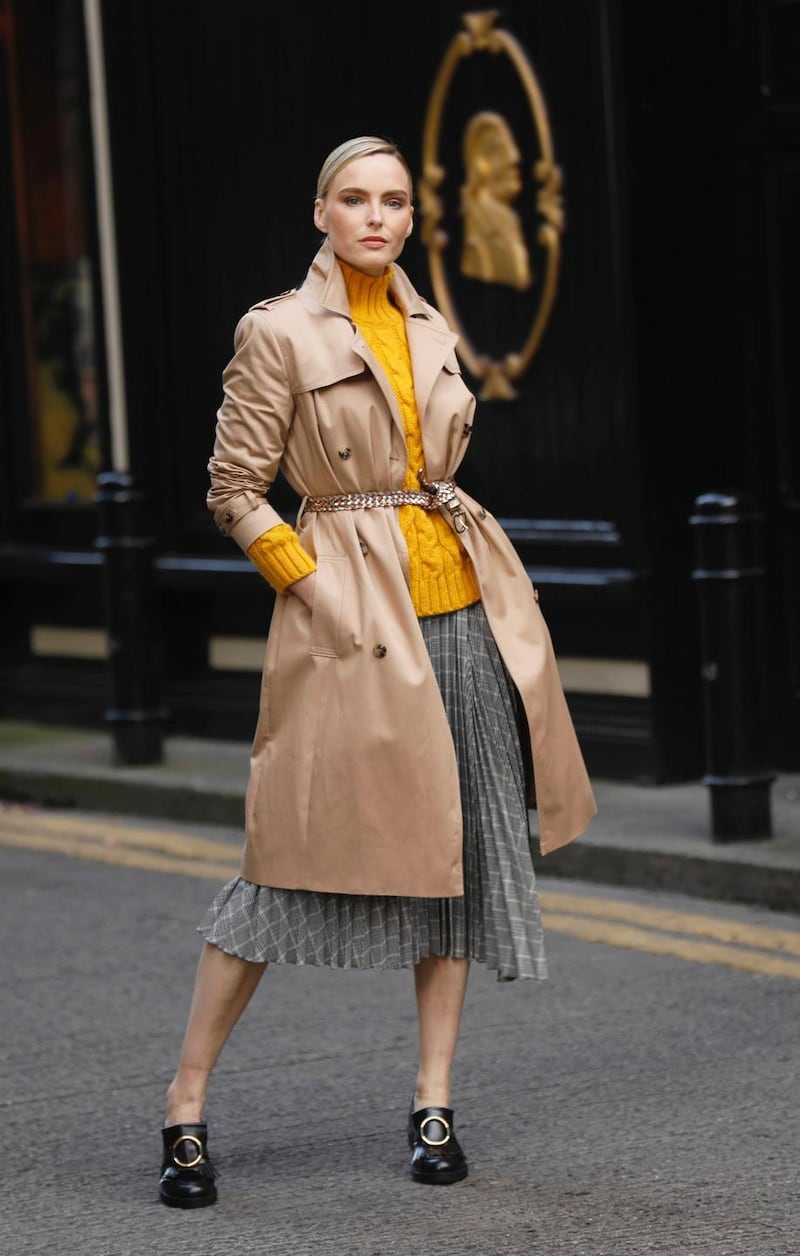 Longline trench coat with stormwear, €110; cable-knit funnel neck jumper M&S collection, €47.50; checked asymmetric pleated midi skirt, €55
