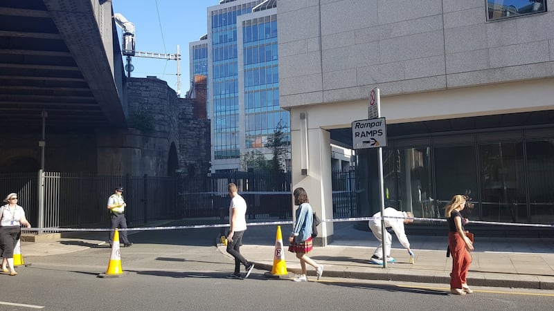 Garda forensic officers examine the scene of the assault in Dublin. Photograph: Paddy Logue