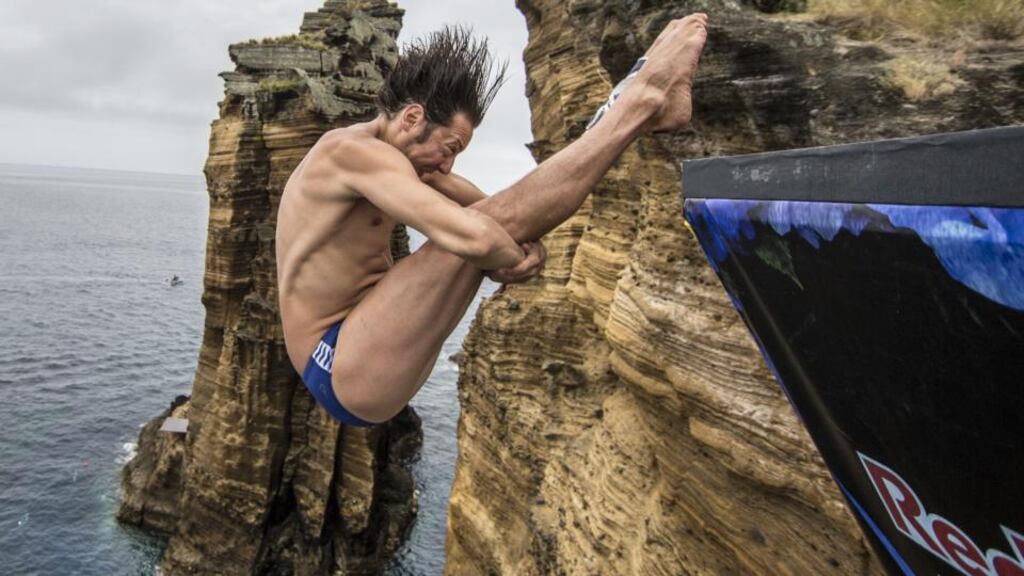 Cyrille Oumedjkane of France dives from the 28-metre platform during the Red Bull Cliff Diving World Series in the Azores
