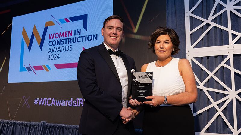 Conor Cooney, managing director, Falcon Green, presents the excellence in senior leadership - contractor award to Bronagh Carty, John Paul Construction
