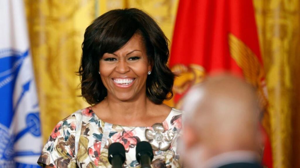 U.S. first lady Michelle Obama smiles at a U.S. military veteran during an event promoting the hiring of veterans and military spouses in the East Room of the White House in Washington, April 30, 2013. REUTERS/Larry Downing (UNITED STATES - Tags: POLITICS MILITARY)
Michelle Obama and her daughters are likely to visit the Republic during the G8 meeting in Fermanagh in June