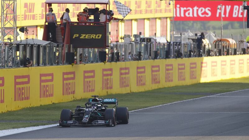 Lewis Hamilton crosses the line to take the inaugural Tuscan Grand Prix. Photograph: Luca Bruno/EPA