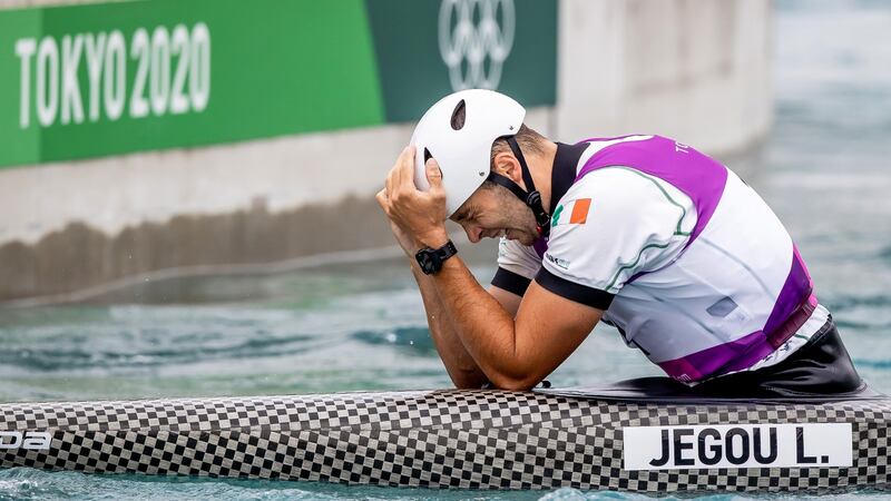 Liam Jegou holds his head in his hands after crashing out of the C1 canoe slalom. Photo: Morgan Treacy/Inpho