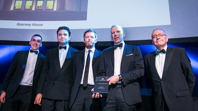 Frank McDonald, Judging Co-ordinator presents the House Extension Refurbishment award to the Broadstone Architects team.